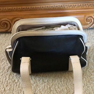 11x7 black leather bag with cream colored leather trim. Ann Taylor.